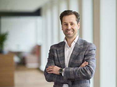 Jack Geurtjens standing in an office